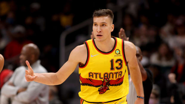 Jan 12, 2022; Atlanta, Georgia, USA; Atlanta Hawks guard Bogdan Bogdanovic (13) reacts after making a basket during the first quarter against the Miami Heat at State Farm Arena